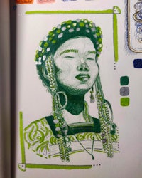 an open book with a drawing of a woman in a green dress