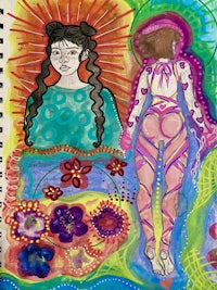 a spiral notebook with a drawing of a woman and flowers